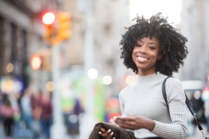 Woman enjoying the city smiles with her dental veneers